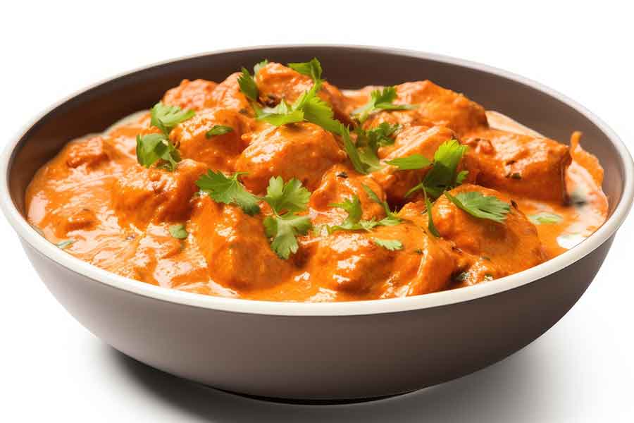 Butter Chicken — tender chicken in creamy tomato curry sauce